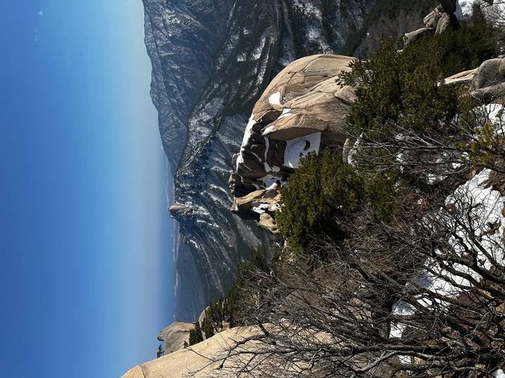 Snow-capped granite peaks and rugged ridges of Seoraksan National Park under a crystal clear blue sky.