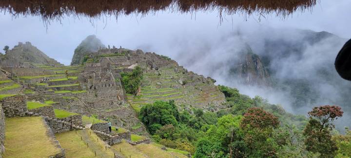 Panoramic view of Machu Picchu’s terraced citadel emerging from the misty Andes.
