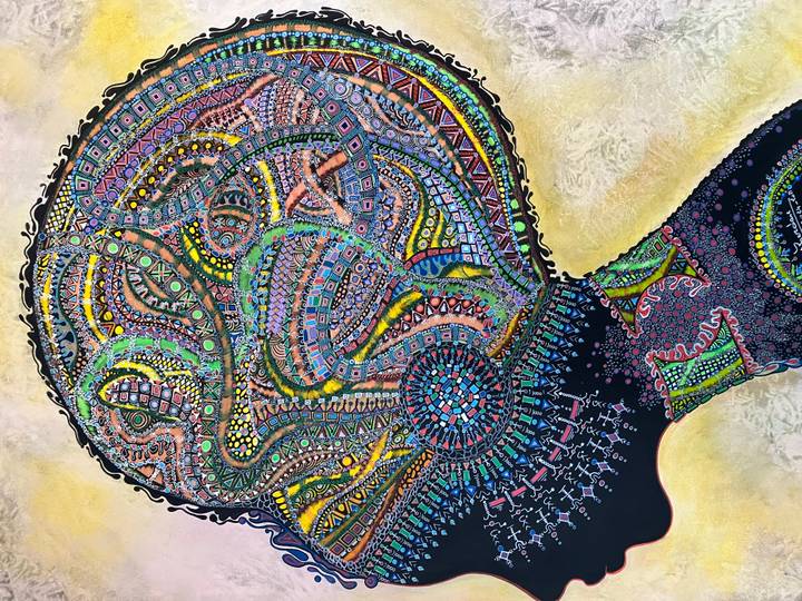 Close-up of a colorful abstract painting filled with intricate patterns.