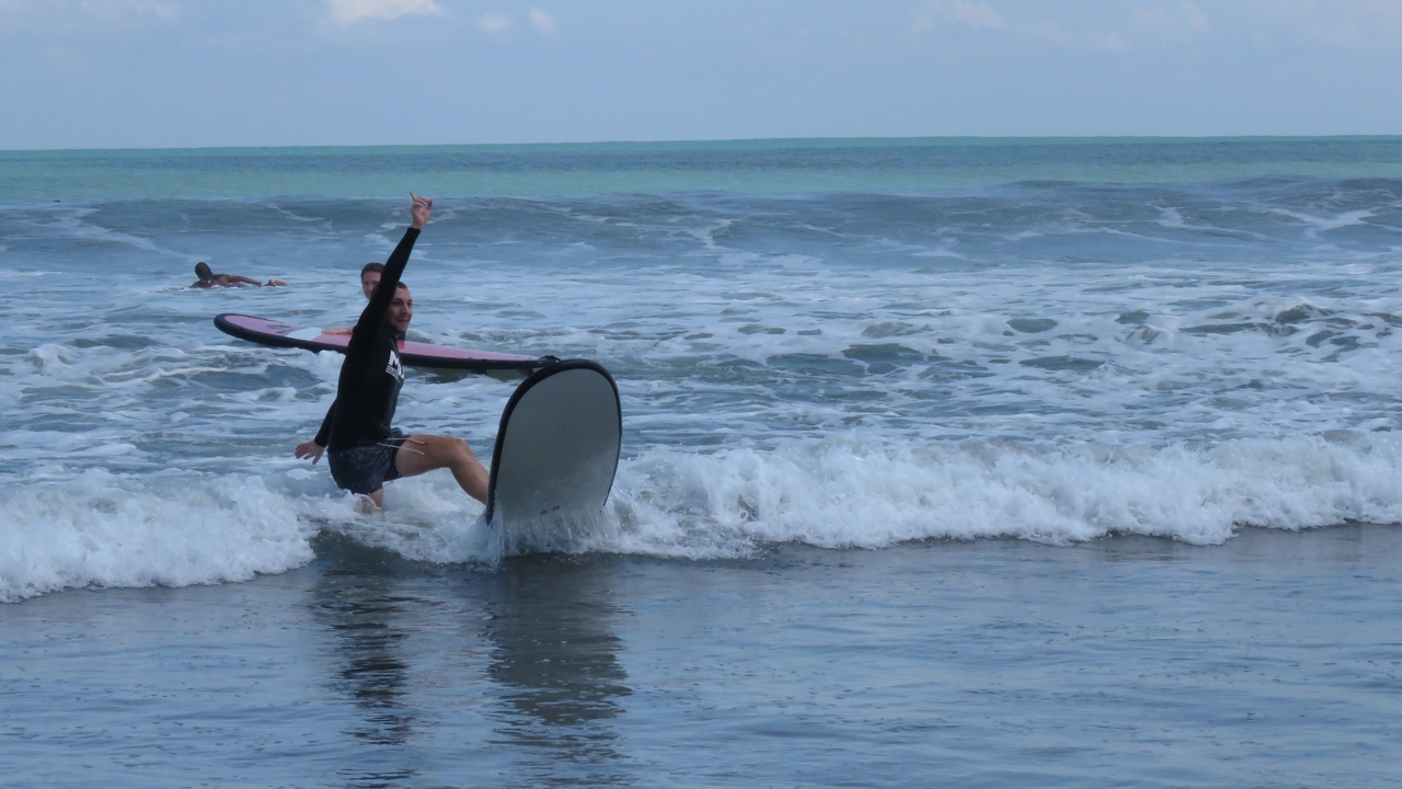 Person surfing in the ocean.