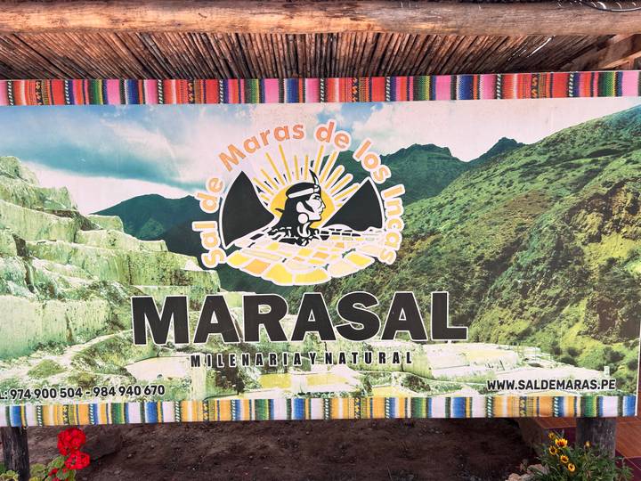 Printed information sign advertising Maras salt with graphics and website details.