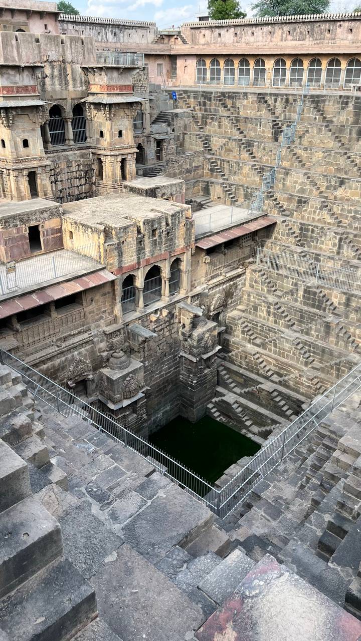 Aerial view down the dizzying geometric layers of Chand Baori stepwell in Rajasthan.