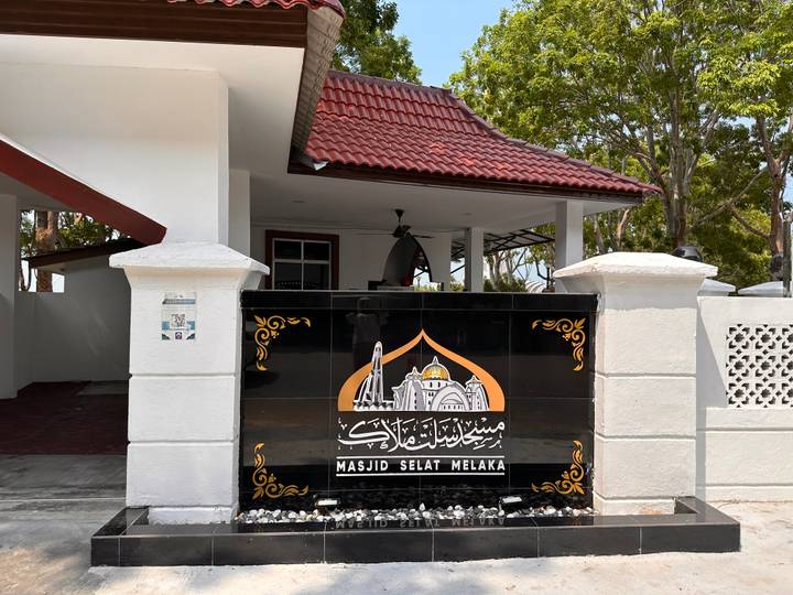 Signboard for Masjid Selat Melaka, the famous floating mosque.