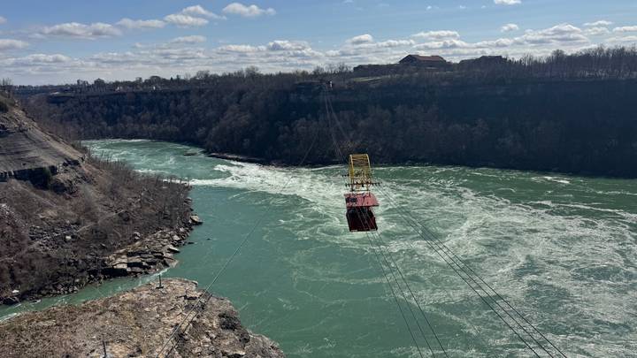 Whirlpool Aero Car suspended above the swirling green waters of the Niagara River gorge.