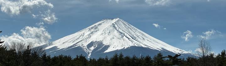 Iconic snow-capped Mount Fuji framed against clear blue sky
