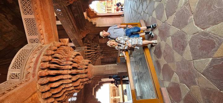 Couple in Fatehpur Sikri’s Diwan-i-Khas beneath the famous intricately carved central pillar.