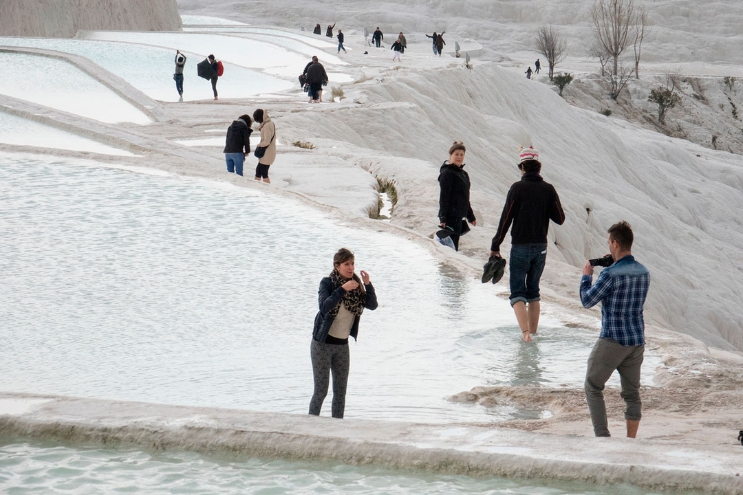 Group of people at a cable car terminal.