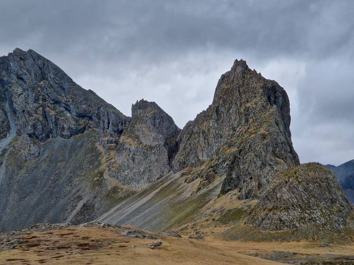 Close-up of rugged grey volcanic peaks under overcast skies