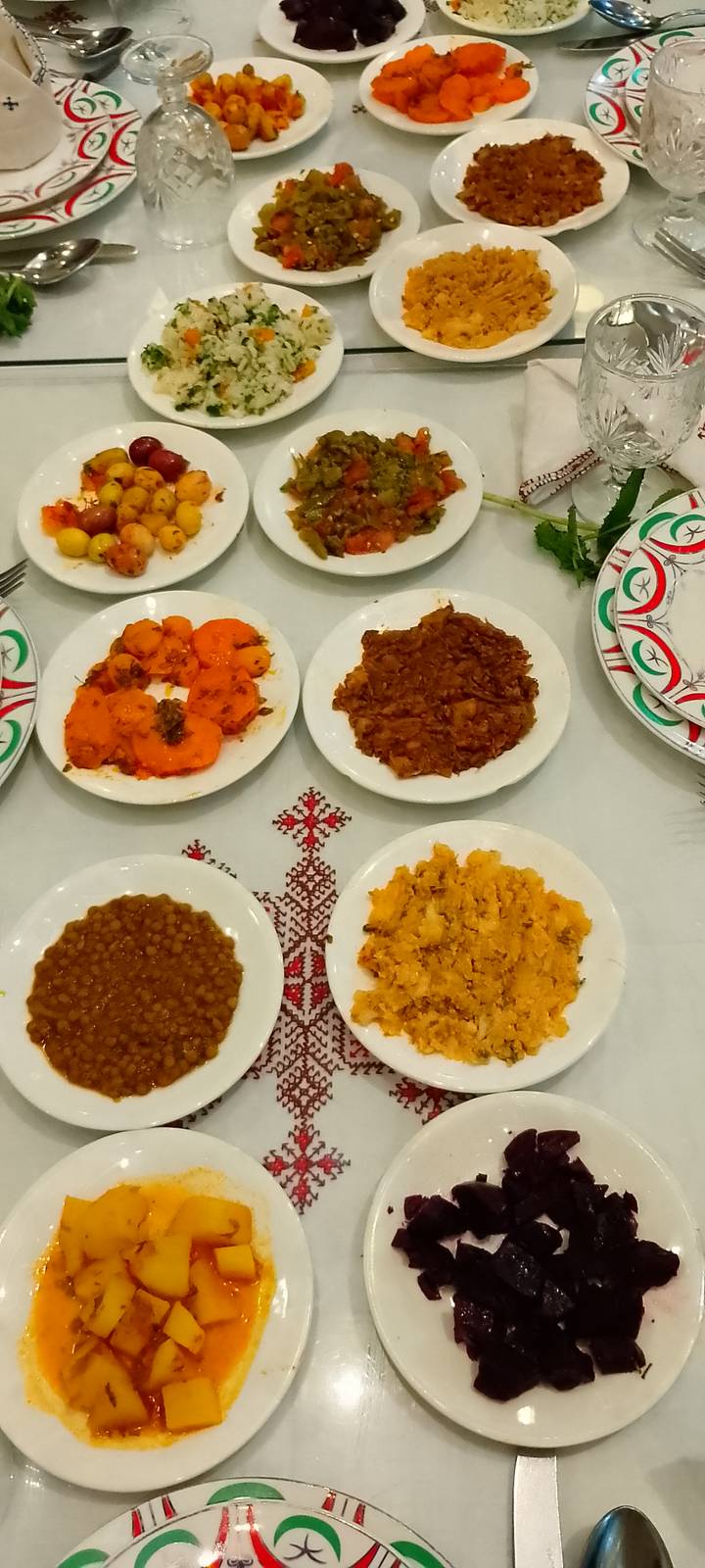 Close-up of assorted Moroccan side dishes on patterned tablecloth
