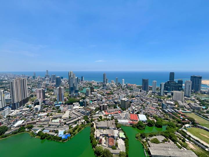 Sweeping aerial panorama of Colombo’s modern skyline and coastline.