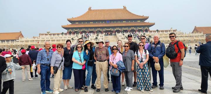 Group poses in front of the Hall of Supreme Harmony inside Beijing’s Forbidden City.