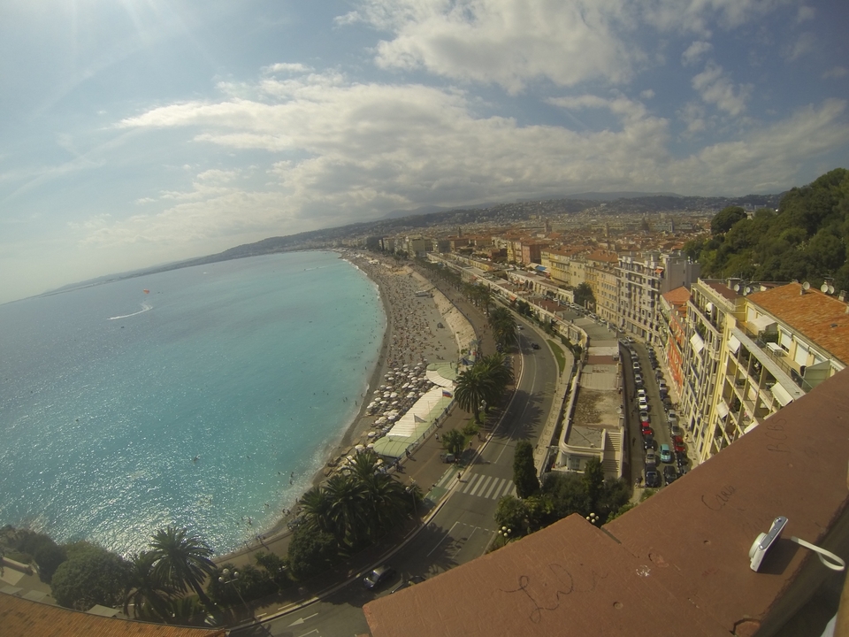 Panoramic view of a coastal city with a beach.