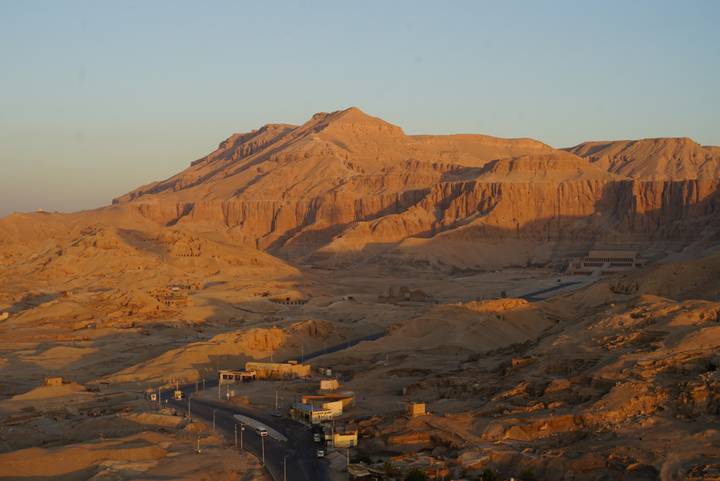 Golden sunrise lighting the rugged cliffs and valleys of the West Bank near Luxor.