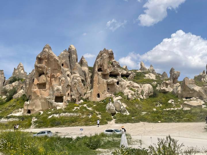 Eroded tufa rock dwellings with windows and caves carved into cliffs