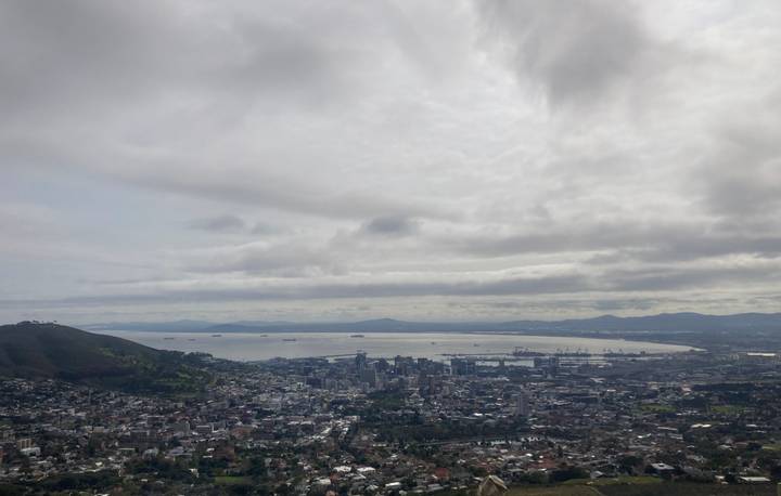Panoramic view over Cape Town and Table Bay under an overcast sky, seen from a high vantage point