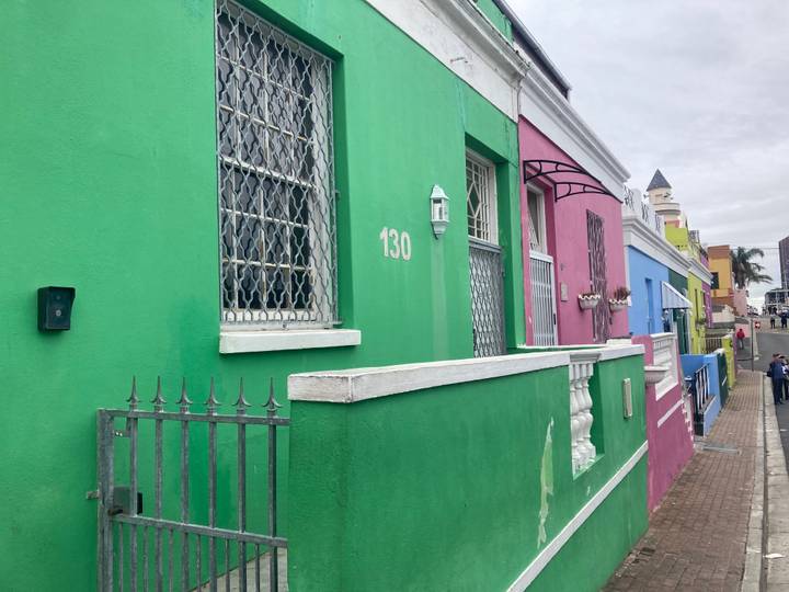 Row of brightly painted houses with wrought-iron gates in Bo-Kaap, Cape Town