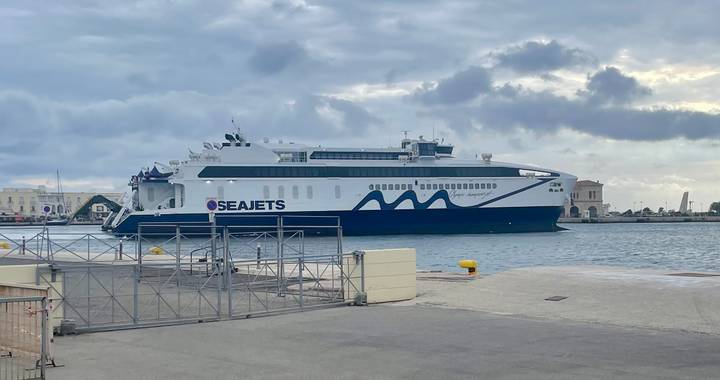 Seajets high-speed ferry docked at a Greek island port under gray skies