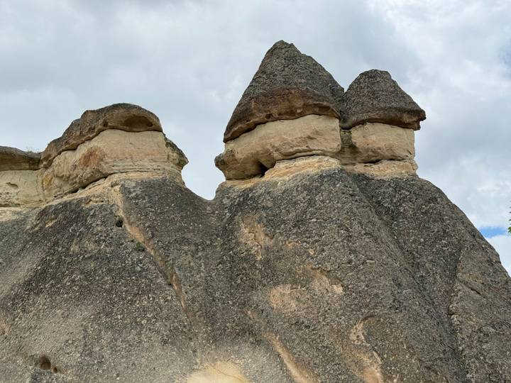 Close view of the unique three-headed fairy chimney rock formations in Pasabag, Cappadocia.