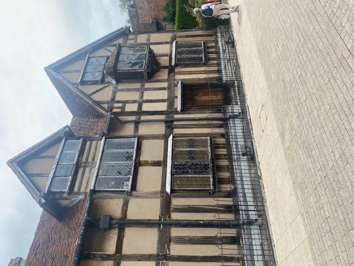 Timber-framed birthplace house of William Shakespeare with leaded windows.