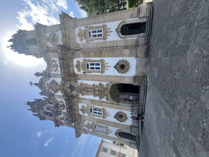 Grand baroque church façade with twin bell towers and ornate stonework