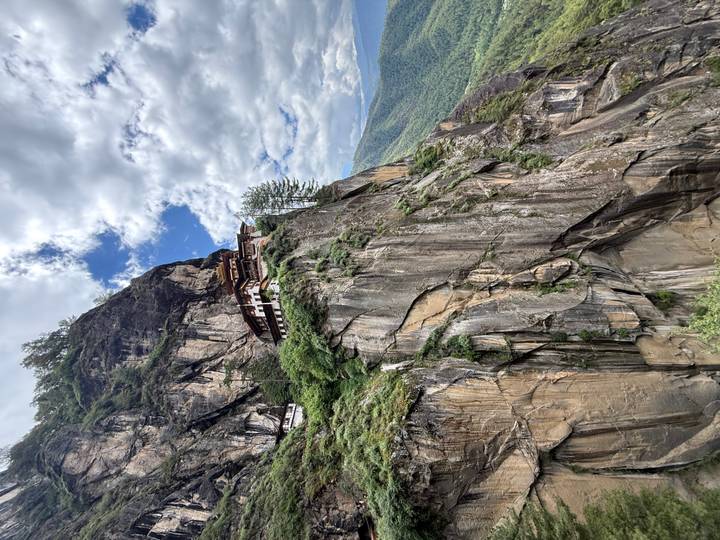 Iconic Tiger’s Nest Monastery perched on a sheer cliff face high above a forested valley