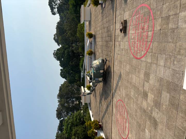 Historic military helicopter parked on the rooftop helipad of Ho Chi Minh City’s Reunification Palace.