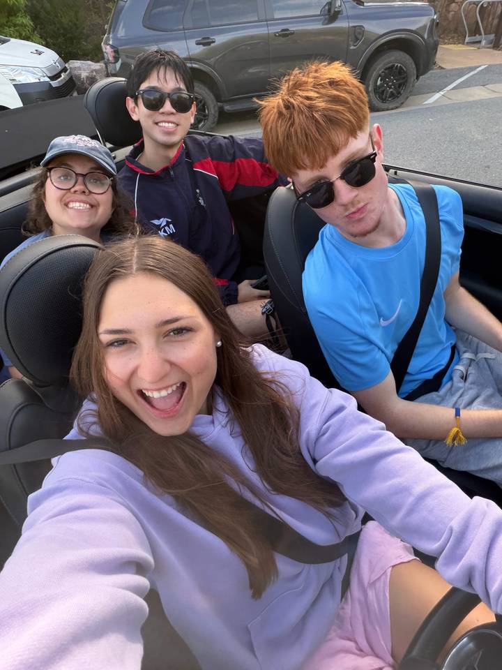 Happy selfie inside convertible car during road trip