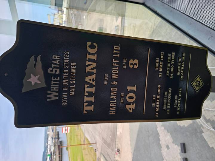 Information plaque about the Titanic on display inside a museum window