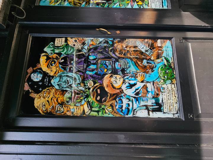 Decorative painted door panel featuring colourful sci-fi characters in Dublin