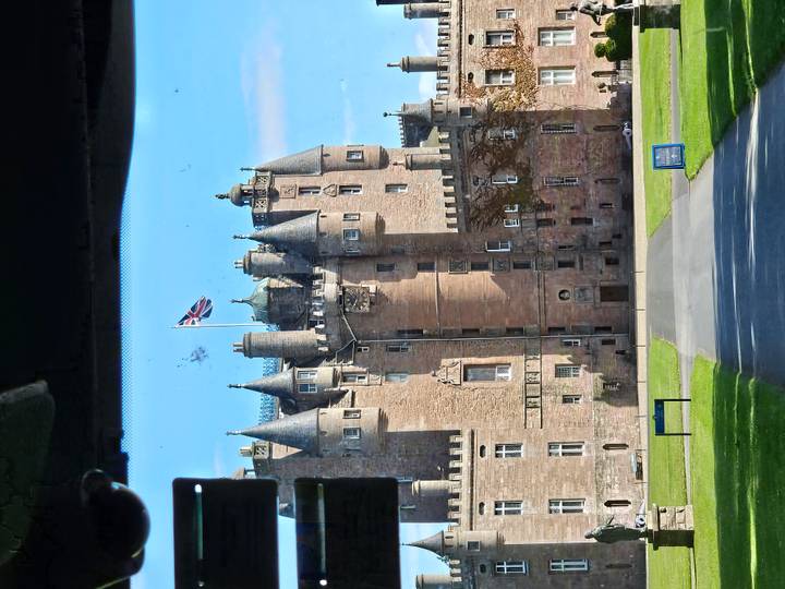 Closer view of Glamis Castle taken from inside a vehicle with some window glare