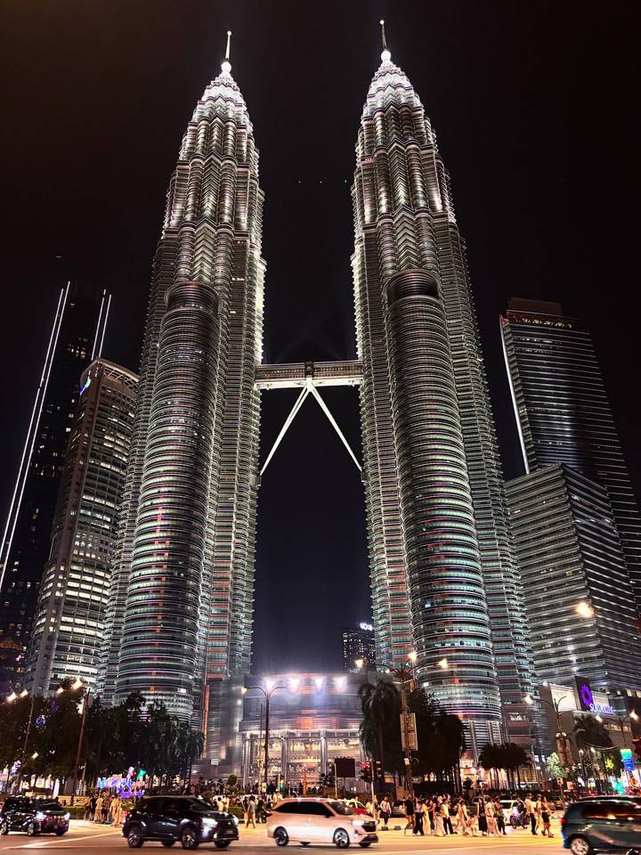 Illuminated Petronas Twin Towers soaring into the night sky
