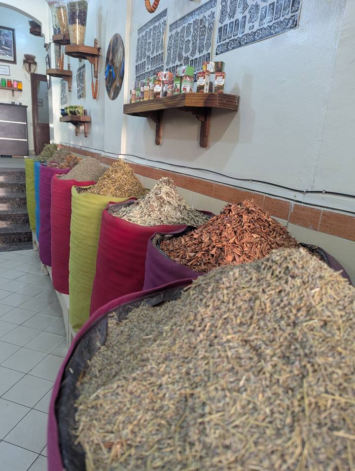 Colourful sacks filled with assorted spices and herbs in a Moroccan market shop