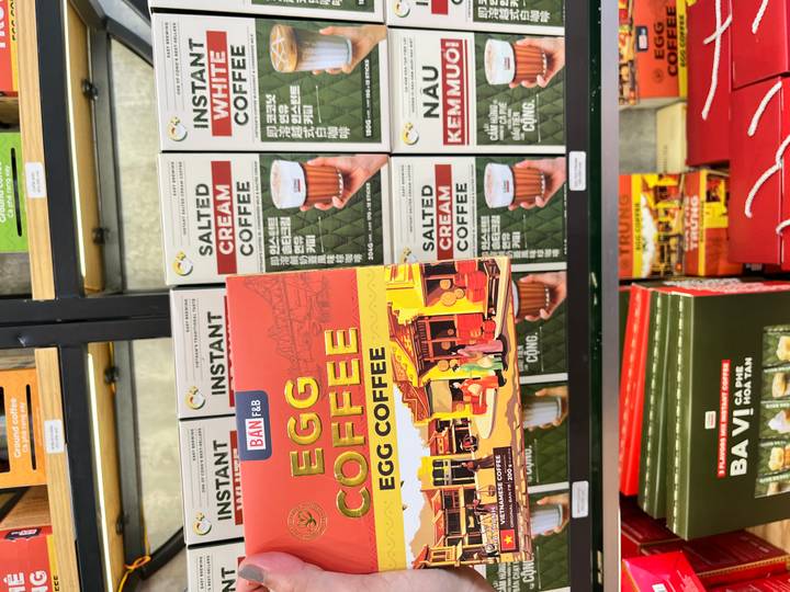 Close-up display of boxed egg coffee, salted cream coffee, and other Vietnamese coffee products.
