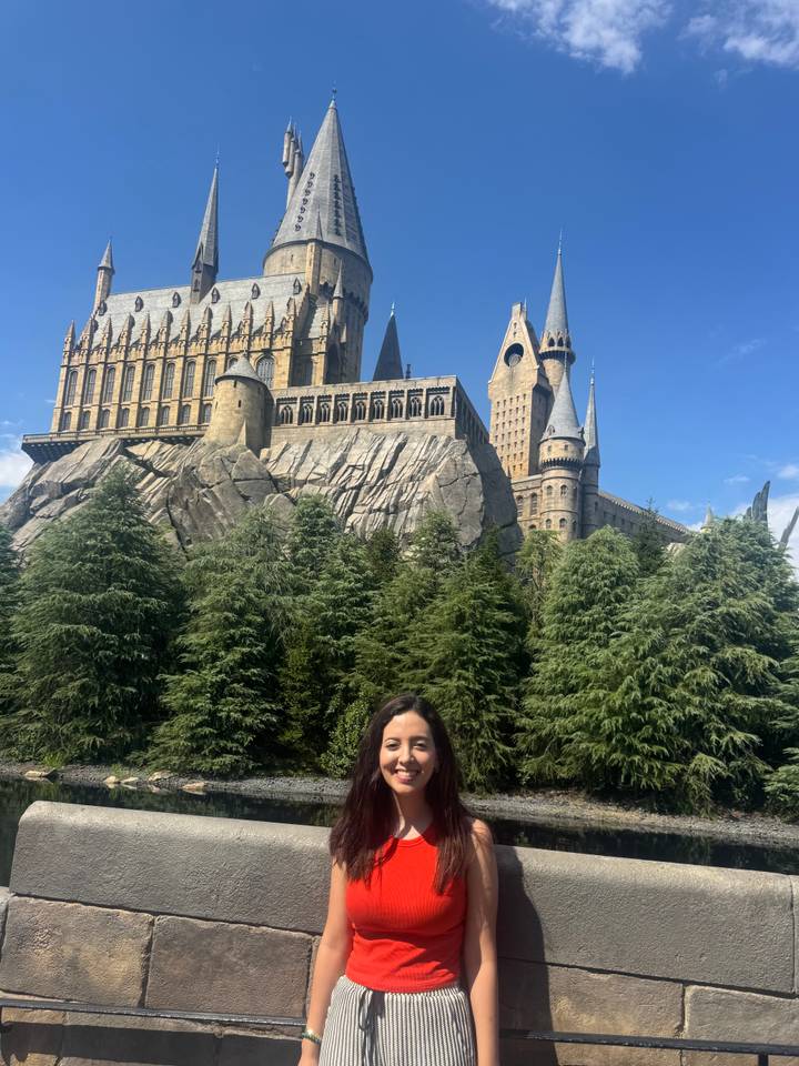 Traveller poses before the towering Hogwarts Castle replica at Universal Studios Japan.