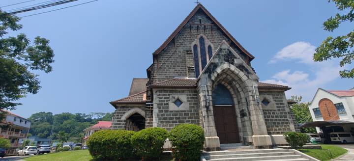 Stone-built historic church under a clear blue sky