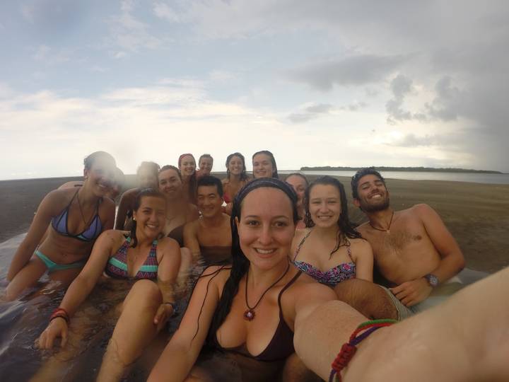 Group of friends in a beach-side hot tub.