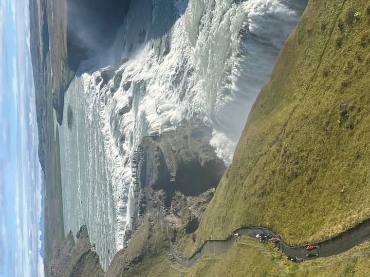 Sweeping aerial perspective of powerful Gullfoss waterfall and canyon.