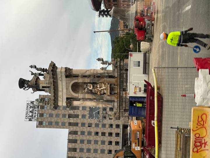 Monument at Plaça d'Espanya Barcelona surrounded by construction barriers and machinery