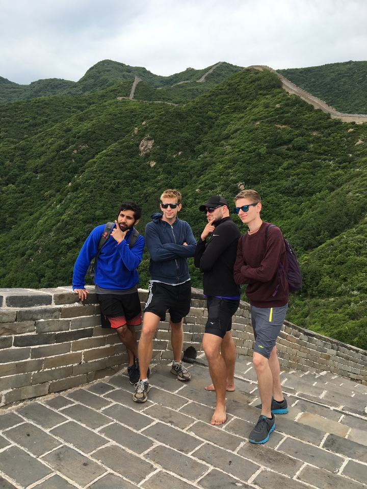 Men posing on the Great Wall of China.