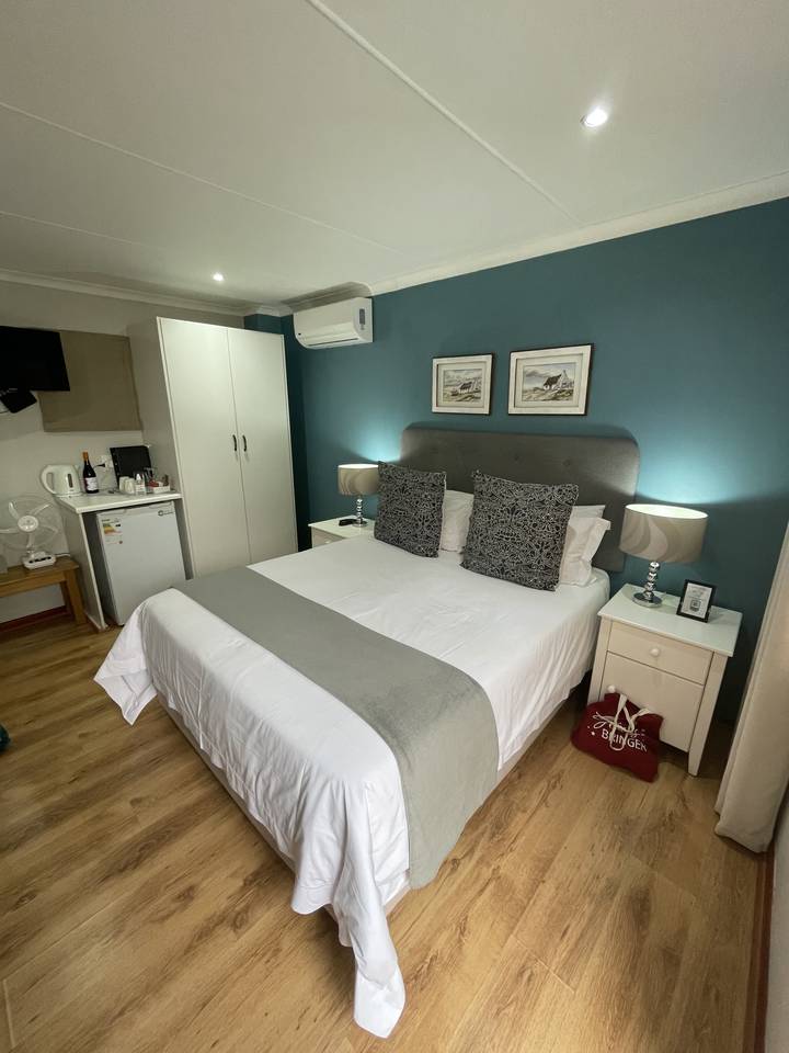 Interior of a clean, well-lit bedroom with modern decor.