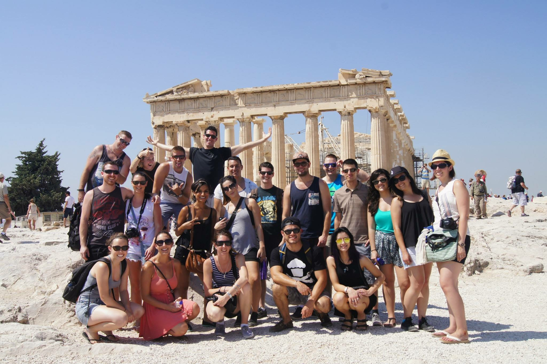 Group photo at an ancient ruin, possibly the Acropolis.