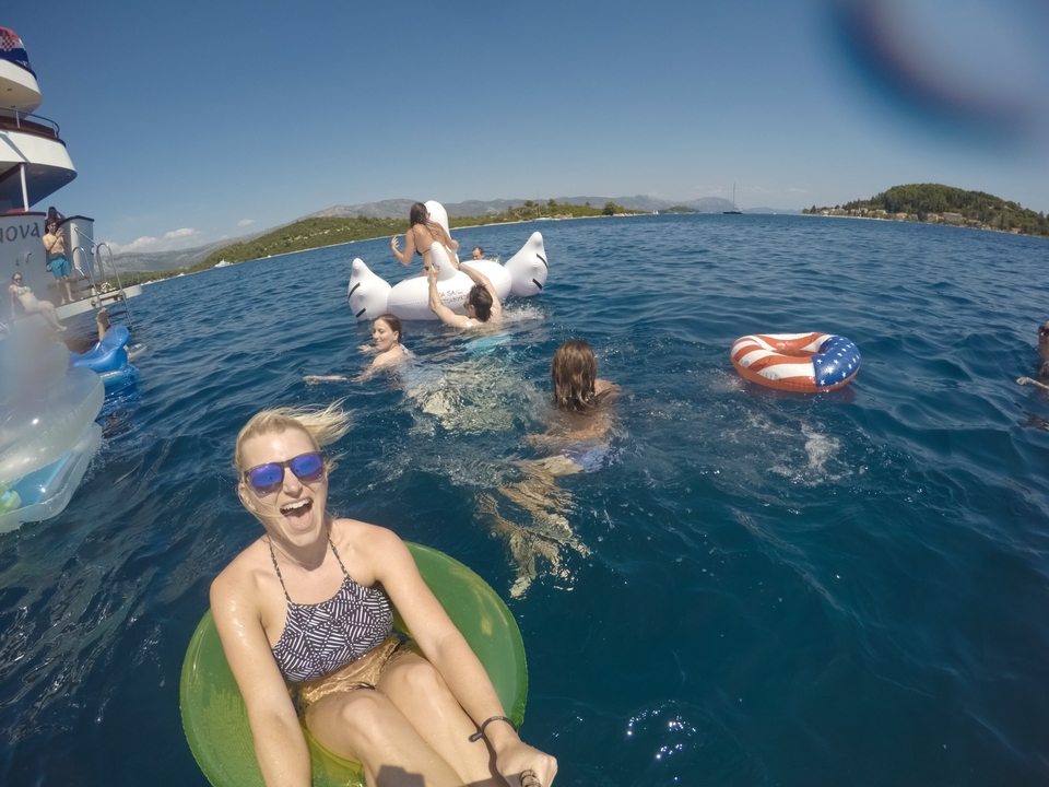 Group of people swimming and enjoying in the ocean.