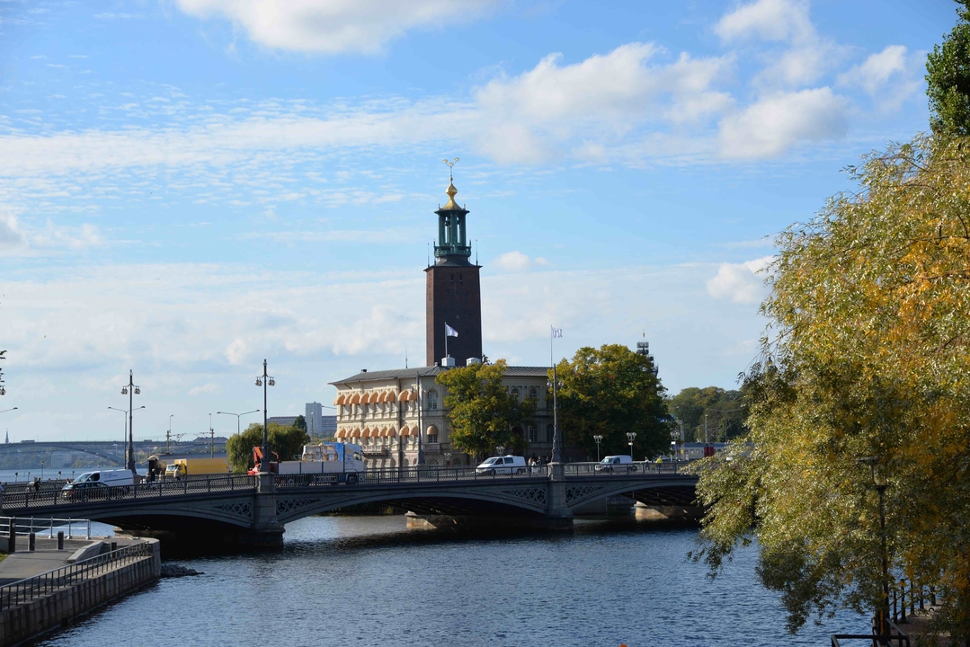 Stockholm city hall seen from a bridge over water.