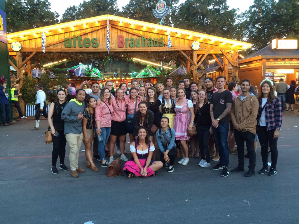 Group of people in traditional Bavarian attire at a festival.