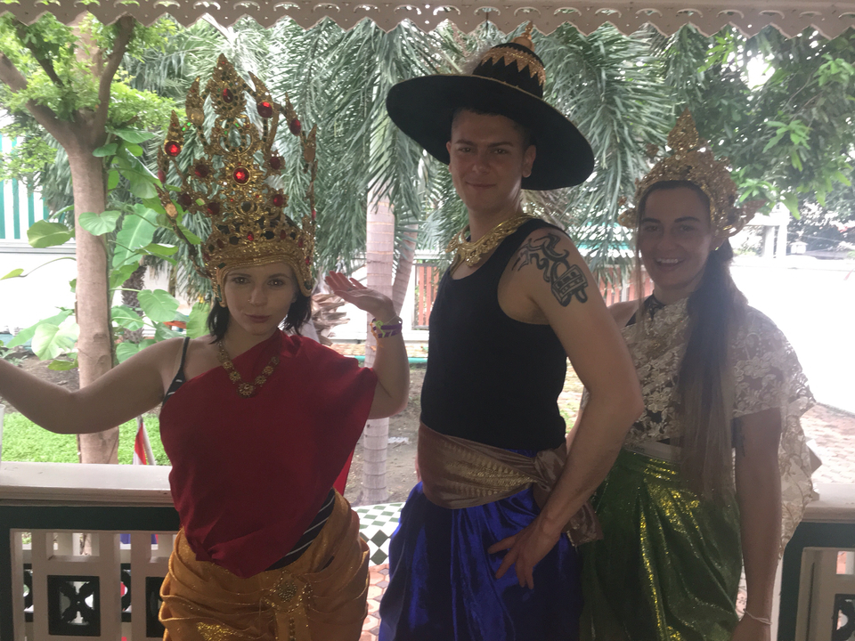 Three people dressed in traditional attire.