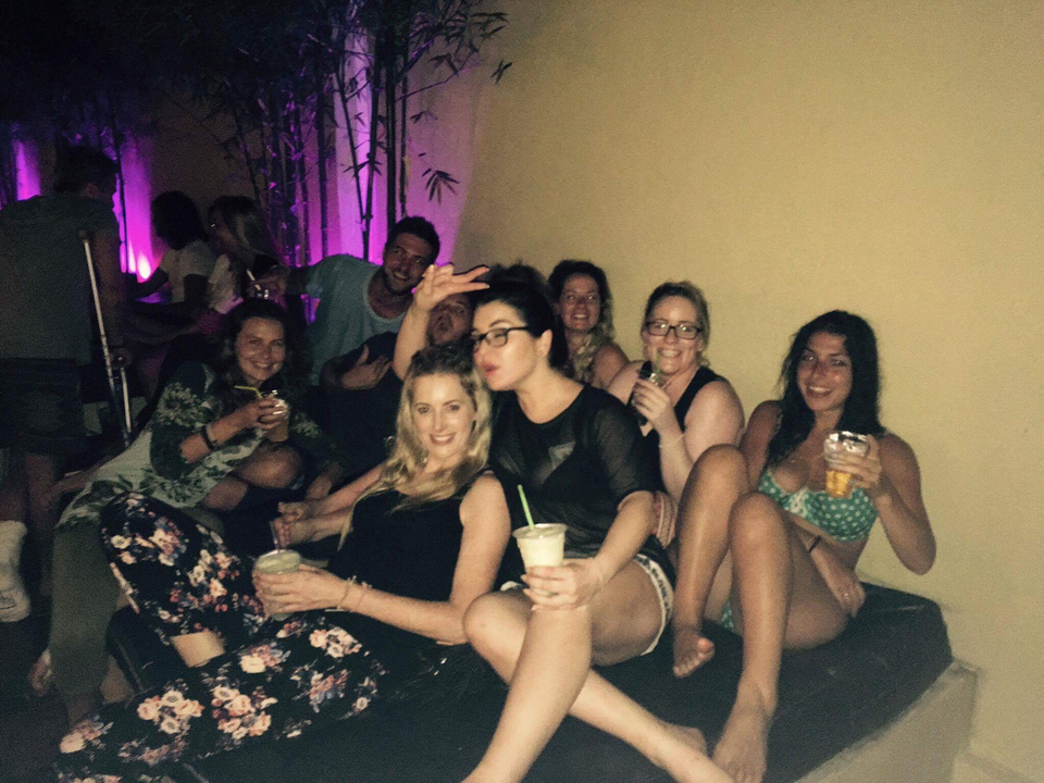 Group of people enjoying themselves in an indoor space.