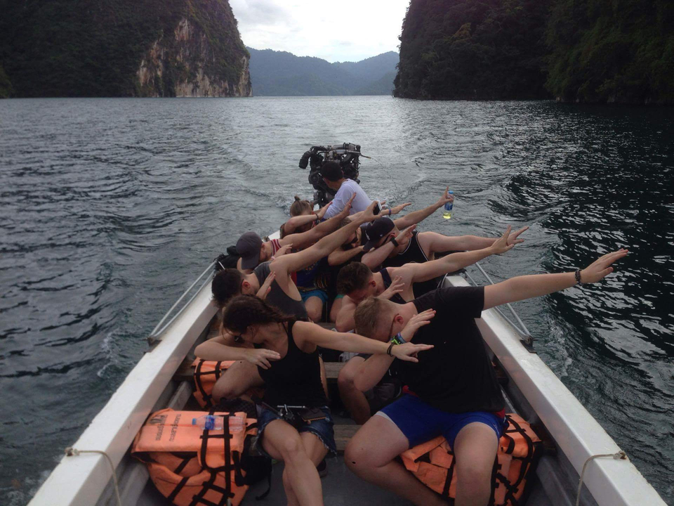Group of people posing on a boat.
