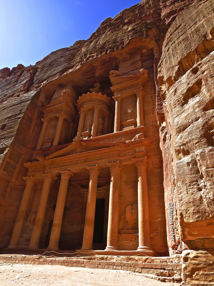 Close-up of The Treasury's facade at Petra in warm sunlight.