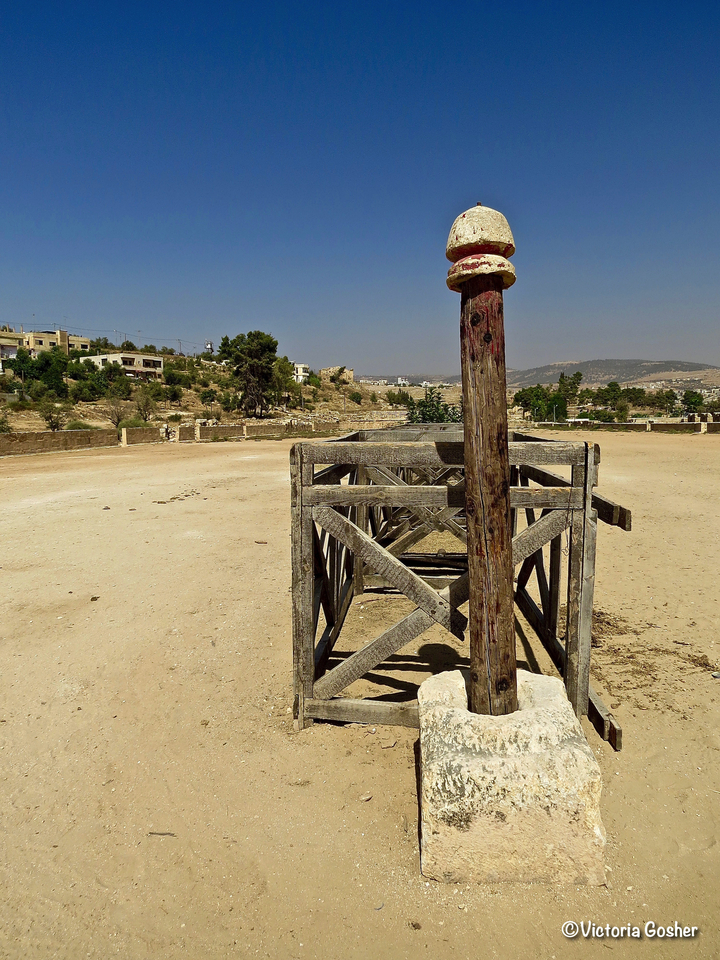Wooden structure and open desert landscape.