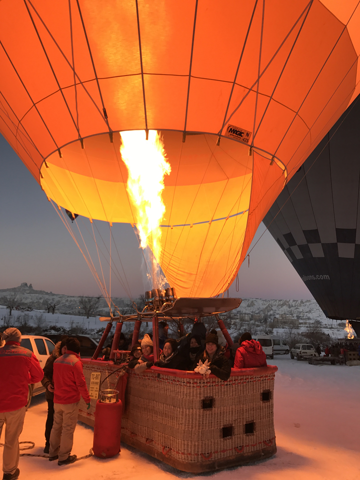 Flames from a hot air balloon burner during inflating.